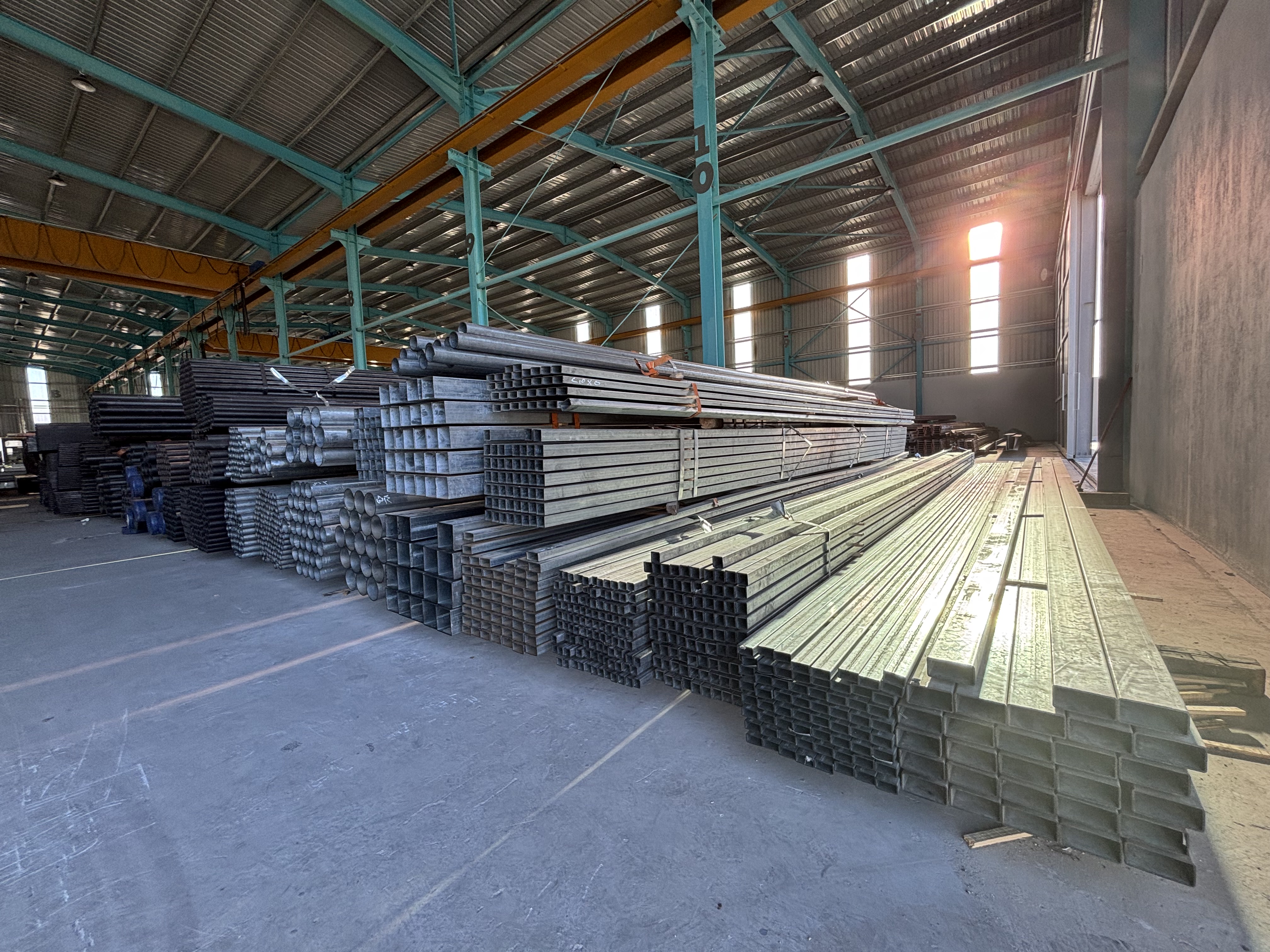 Stacked steel pipes in the Safarin Steel warehouse